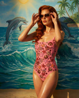 Woman in a pink swimsuit with a dolphin and beach background