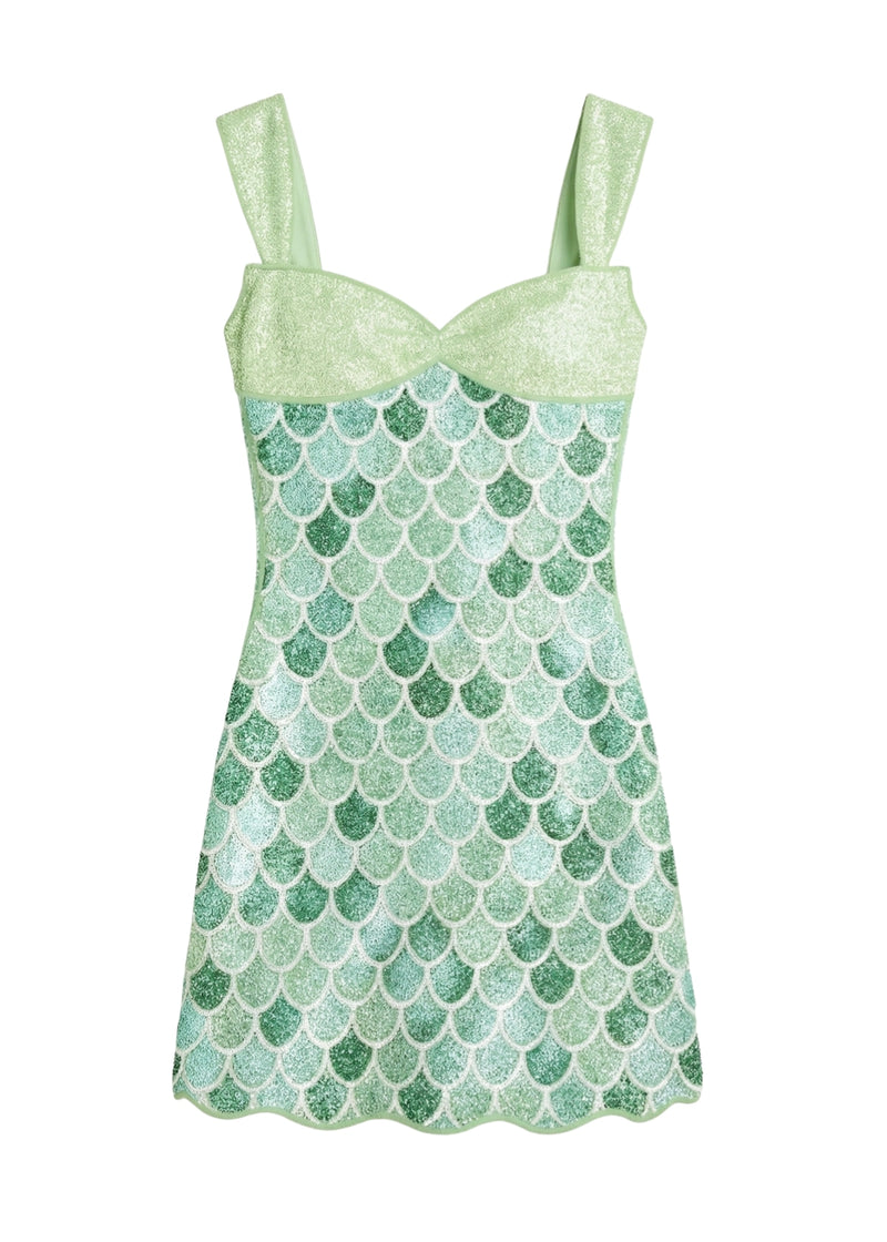 Green mermaid scale patterned dress on a white background