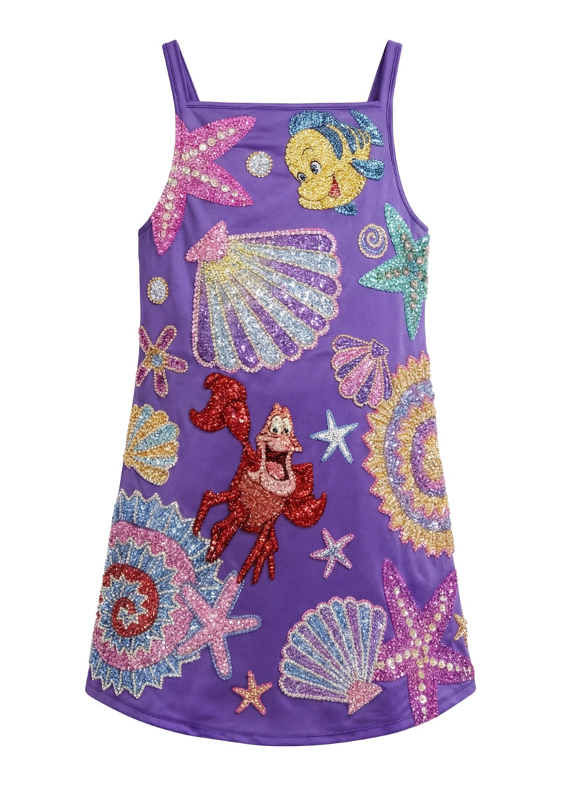 Purple dress with sequin designs of sea creatures on a white background