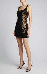 Black dress with gold embroidery on a white background