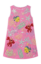 Pink dress with animated character designs on a white background