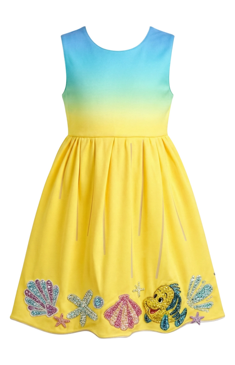 Gradient dress with colorful embellishments on a white background