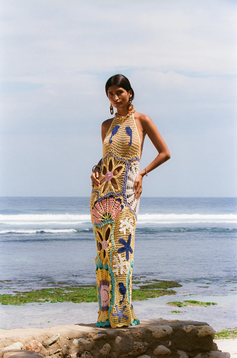 Women wearing Pearl Halter Crochet Maxi Dress in Multi Coloured in sea shore 