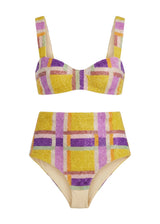 Colorful checkered bikini set on a white background