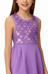 Purple dress with scalloped top and plain skirt on a white background